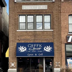 Exterior of the Petters Building. Greek Cravings on the ground floor.