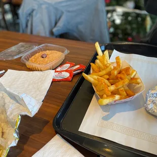a tray of fries and a sandwich