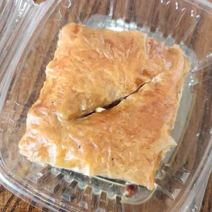 a piece of pie in a plastic container
