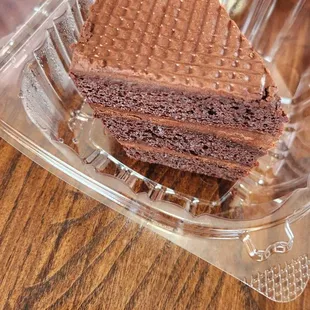 a piece of chocolate cake in a plastic container