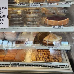 a variety of baked goods in a display case
