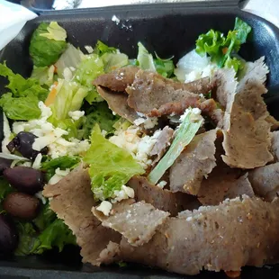 Gyro salad minus banana peppers and onions.