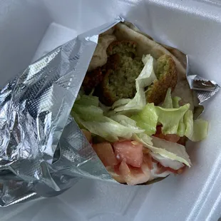 a sandwich wrapped in foil