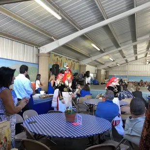 a crowd of people sitting at tables