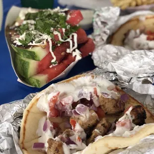 Chicken souvlaki with tomato and onions and yogurt sauce, bomb