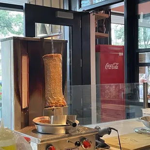 a pita being cooked in a commercial kitchen