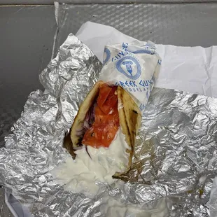 a hot dog wrapped in foil