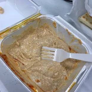 a fork in a casserole dish