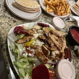 greek salad with chicken and fries