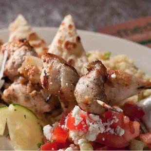 a plate of food with meat and vegetables