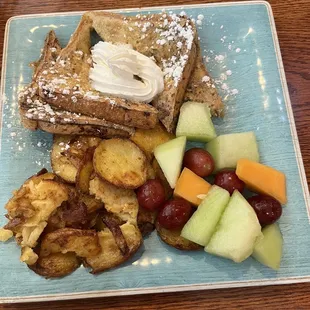 French toast platter with fruit salad and home fries