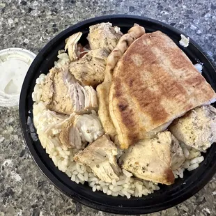 Chicken Greek Burrito Bowl with pitta bread and extra tzatziki