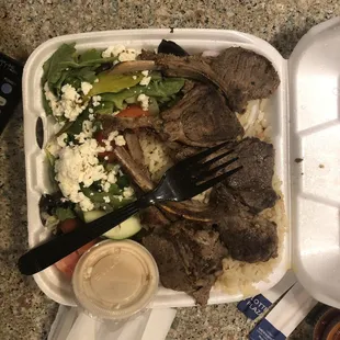 a meal in a styrofoam container