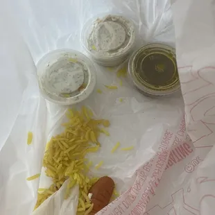 a hot dog, pasta, and condiments
