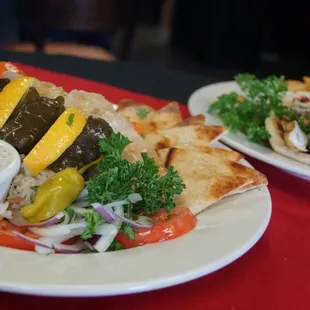 two plates of food on a red table