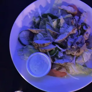 The Greek salad with chicken and side of dill dressing.