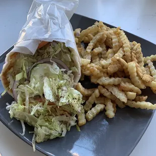 vegan falafel sandwich and french fries