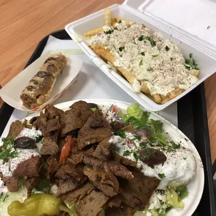 Gyro salad with generous portion of meat and Greek fries.