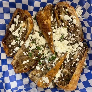 Mike&apos;s Famous Gyrolls- Eggrolls stuffed with gyro meat, feta, and grilled onions