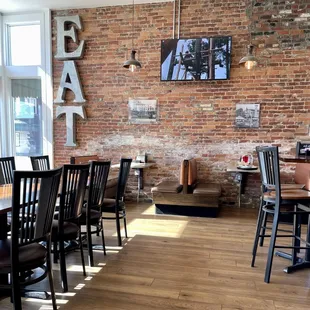 a brick wall and tables