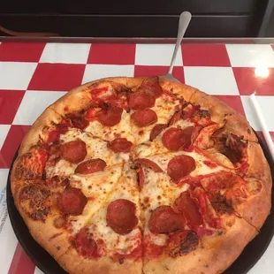 Medium pepperoni and bacon pizza