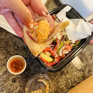 Their amazing spicy dip on pita bread with the fresh veggies.