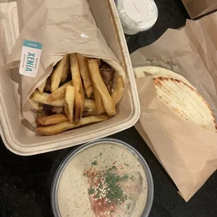 Steak gyro, extra tsaziki and eggplant dip that comes with only 1 pita.
