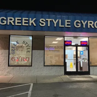 the entrance of a greek restaurant