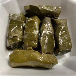 grape leaves in a styrofoam container