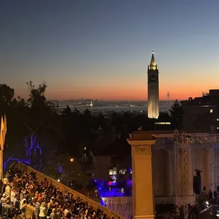 a crowd of people watching a concert