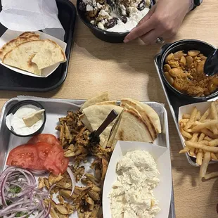 Chicken platter, Mediterranean bowl, and rice and beans and fries for my little one