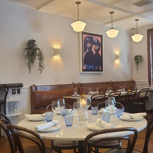 a dining room with tables and chairs
