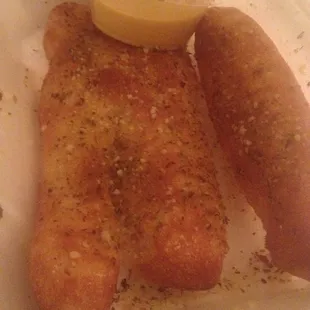 Herb and Parmesan breadsticks with cheese sauce