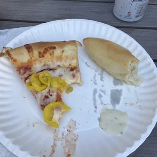Pizza with banana peppers and breadsticks