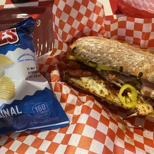 Italian sandwich with chips.