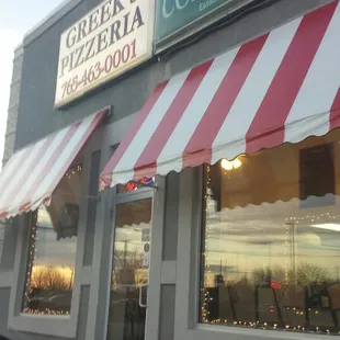 Storefront. Seating in front and side.