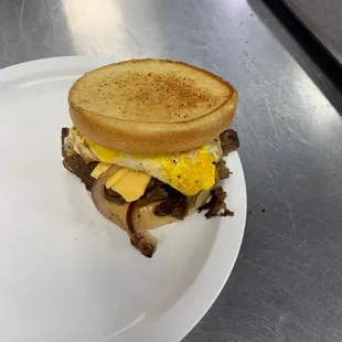 Philly steak, egg, cheese on a toasted bun