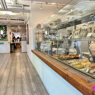 a chef preparing food in a glass case