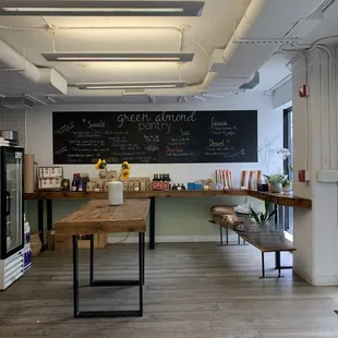 a counter with a chalkboard on the wall