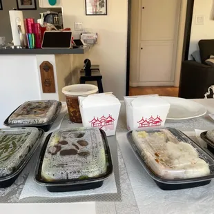 a variety of trays of food