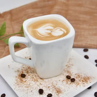 a cup of coffee and coffee beans
