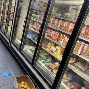 a grocery store aisle with fruit and veggies