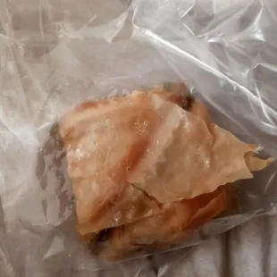a sandwich wrapped in plastic