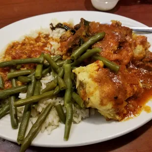 Greek platter. Rice, Green beans, Pistachilo, Mousaka. All very well done for American takes on the dish.