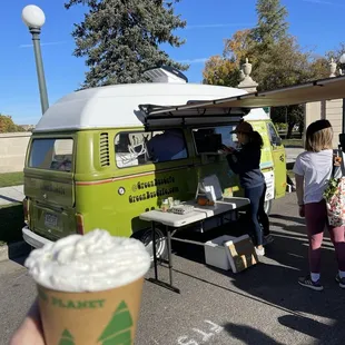 a person holding a cup of coffee