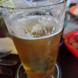a glass of beer on a table