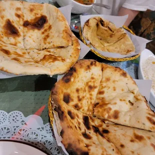 the bread basket - butter Naan, onion kulcha, and 2 chapati