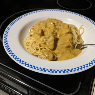 Lamb Korma. I put it on noodles at home instead of the rice. Try it with any off their curries.