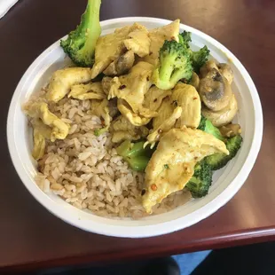 Steam chicken and brown rice with their curry chicken seasoning added.