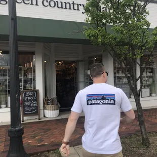 a man walking in front of a store